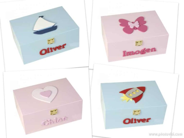 Four personalised memory boxes: a blue box with a sailboat and Oliver, a pink keepsakes box with a butterfly and Imogen, a pink box with a heart and Chloe, and a blue box with a rocket and Oliver.
