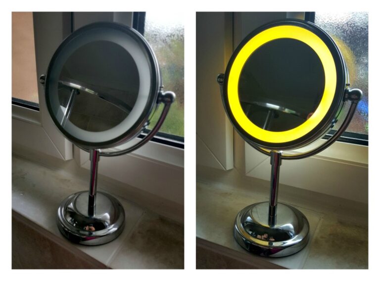 A round LED Magnifying Mirror on a stand is shown in front of a window. On the left, the mirror’s built-in light is off; on the right, the LED ring glows bright yellow, highlighting its magnifying feature.