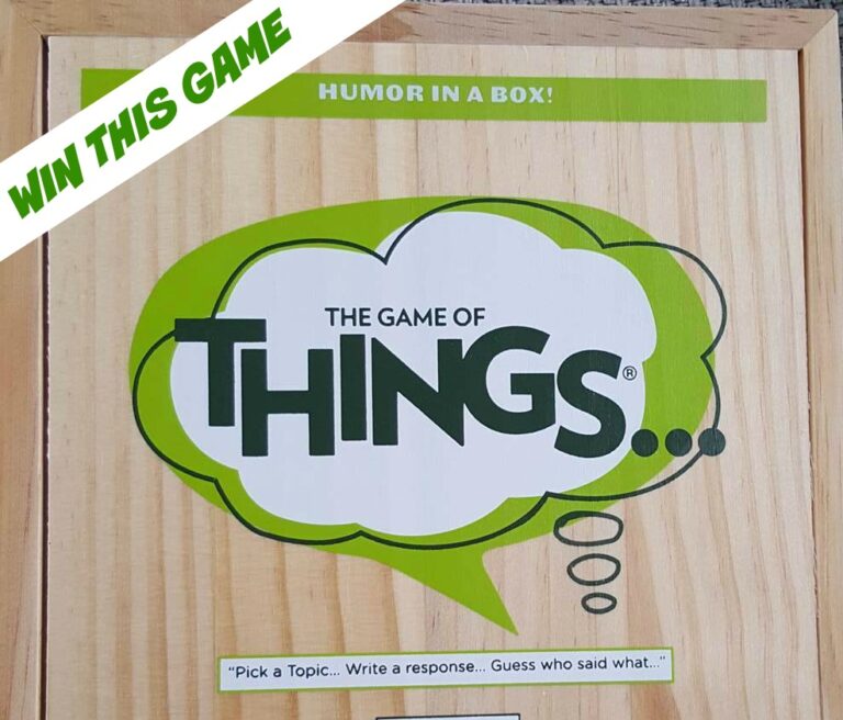 A wooden party game box labelled Game of Things... with green speech bubbles and the tagline Humour in a Box! A banner at the top left reads WIN THIS GAME in bold green letters. Perfect for your next gathering—win Game of Things today!.