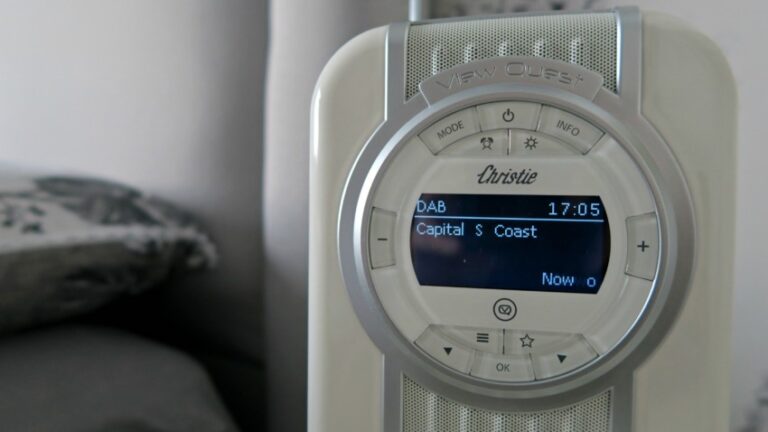 A close-up of a VQ Christie radio displaying DAB 17:05 Capital S Coast and Now o on its screen, with various buttons and controls visible around the display—a perfect shot for a radio review.