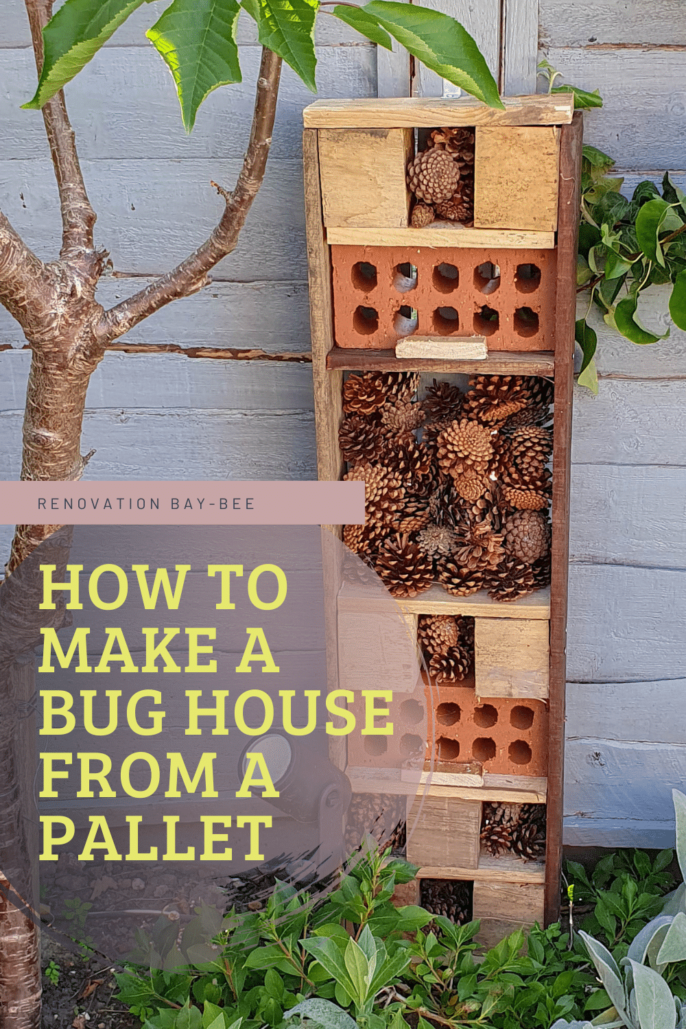A homemade bug hotel shows how to make a bug hotel from a pallet, filled with bricks, wood, and pinecones. It stands against a wooden fence near green plants and a tree. Text overlay: How to make a bug hotel from a pallet.