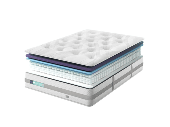 An exploded view of a mattress reveals its multiple internal layers, including a quilted top, foam layers, and pocketed coils—features that make it one of the Best Beds for Summer—all stacked above the base with a fabric exterior.